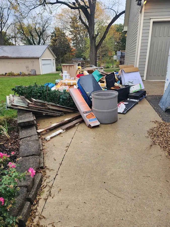 Dumpster being loaded with debris for Commercial Dumpster Rental in Wheaton